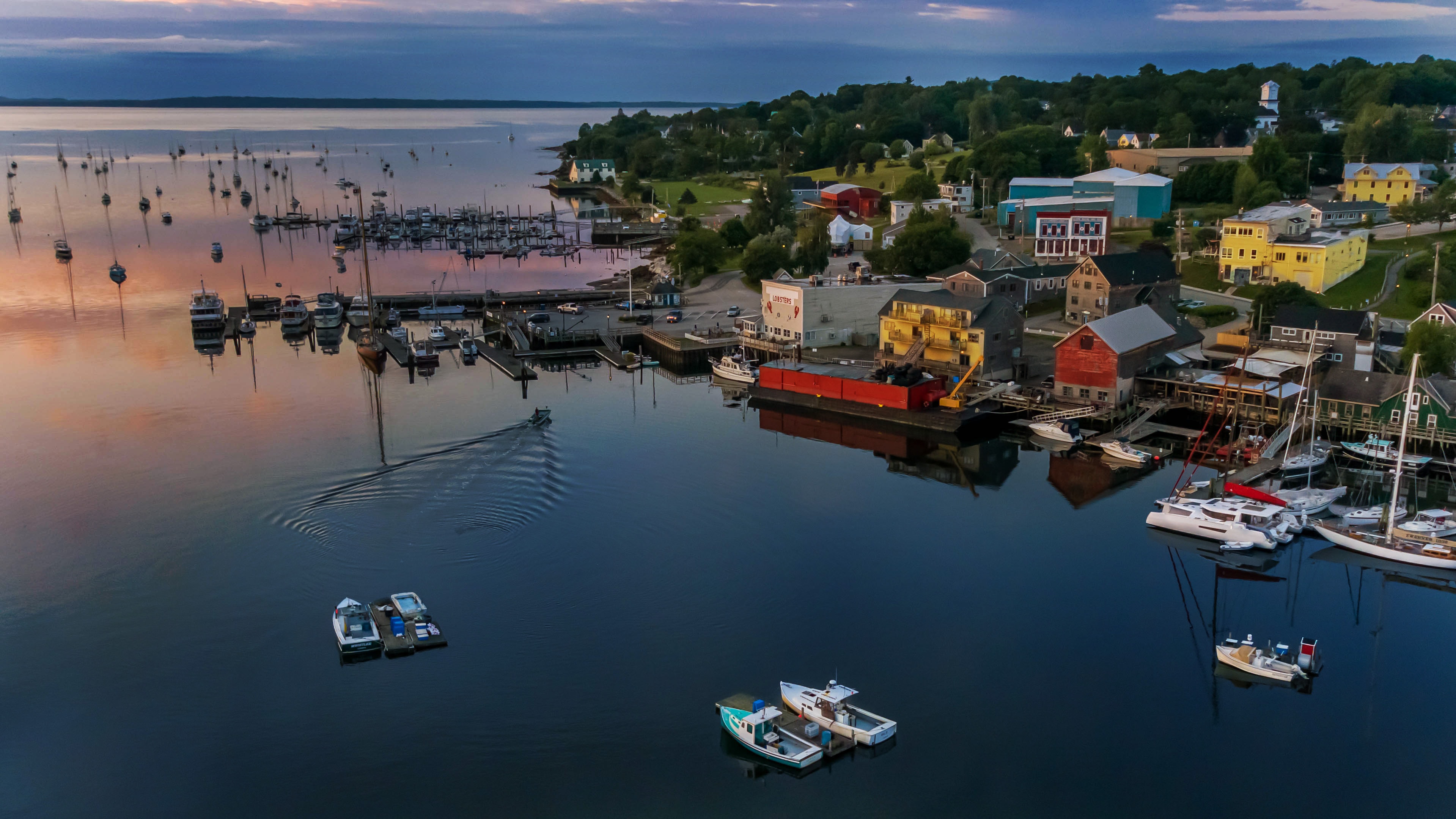 Downeast Maine harbor at dawn, morning mist over still water, May
